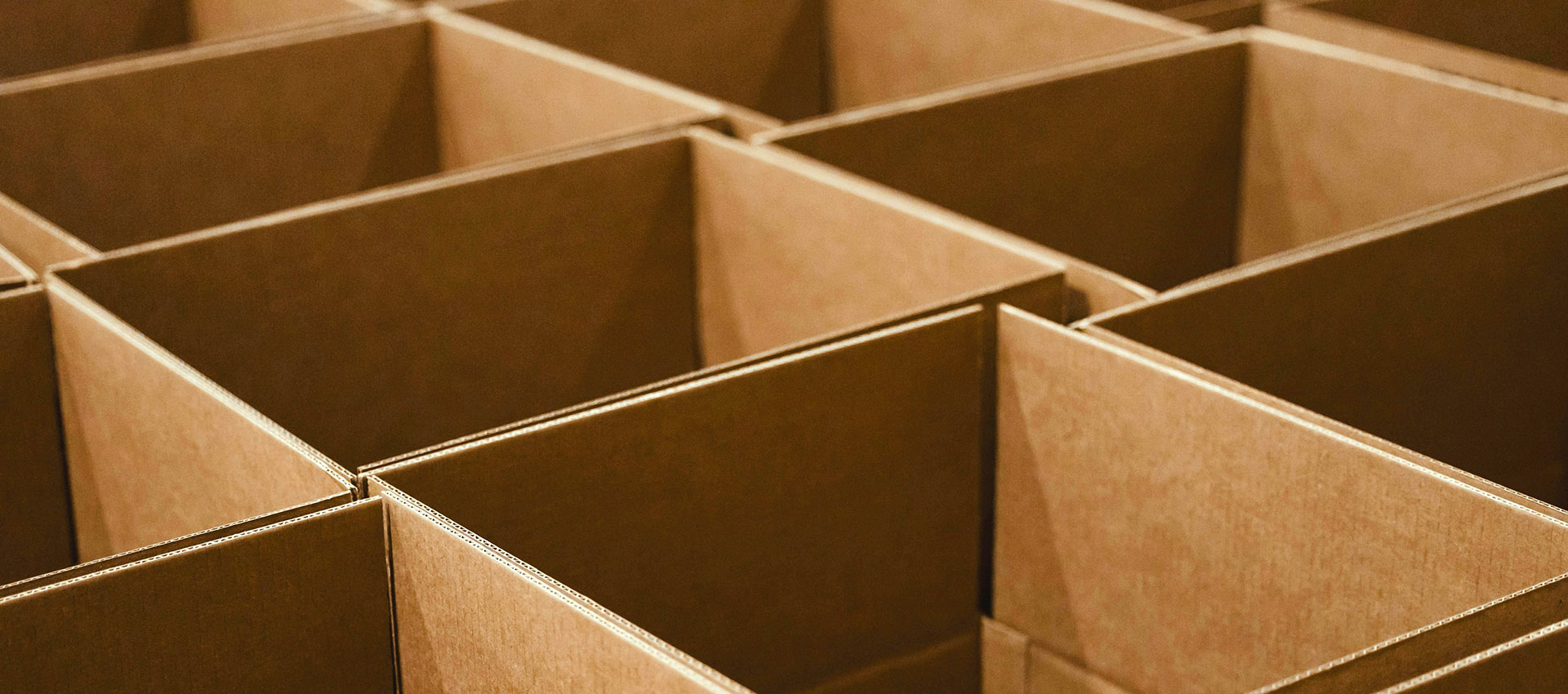 An impressive assembly of moving boxes ready for packing by Box Truck Couriers.